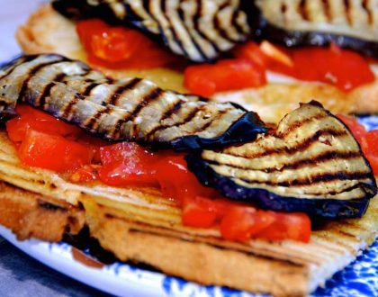 Bruschetta with roasted eggplants, tomatoes and mozzarella